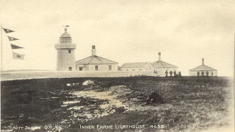 An archive image of Inner Farne lighthouse on the Farne Islands, including the lighthouse cottages.